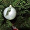 Silver bead patterned birds. vintage christmas toys on new year tree background.