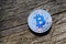 Silver Bitcoin.Blockchain technology. Coin on a wood texture