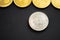 Silver bitcoin crypto currency coin next to others: Litecoin, Ripple, Monerd, Ethereum coin on black background. Digital currency