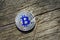 Silver Bitcoin on a Wood Macro shot.BTC