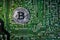 Silver Bitcoins on the chip. The green background. Crypt Of Safety