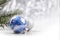 Silver and Blue Christmas ornaments balls on glitter bokeh background with space for text. Xmas and Happy New Year