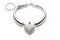 Silver bracelet in the shape of a heart on a white background