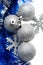 Silver bulbs with snowflakes and blue tinsel