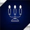 Silver Candelabrum with three candlesticks icon isolated on dark blue background. Vector Illustration