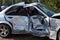 Silver car after a horrible crash accident. Side view,