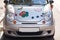 Silver car with painted flowers on the hood