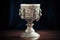 silver chalice adorned with intricate designs