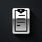 Silver Clipboard with checklist icon isolated on black background. Control list symbol. Survey poll or questionnaire