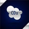 Silver CO2 emissions in cloud icon isolated on dark blue background. Carbon dioxide formula, smog pollution concept