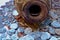 Silver coins falling out of an old brown bottle