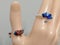 Silver color bijou rings with enamel fish and lotus flower ornament on mannequin hand