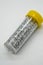 Silver craft glitter in small tubes with yellow caps on