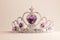 Silver crown with violet heart diamonds isolated on light background. Purple crystal headband. Female Little miss tiara