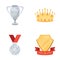 A silver cup, a gold crown with diamonds, a medal of the laureate, a gold sign with a red ribbon.Awards and trophies set