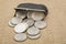 Silver dollars spilled coin purse background