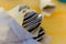 Silver eating utensils sit on a colorful table top at a local restaurant