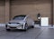 Silver electric car charging at home