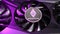 Silver Ethereum coin lies on a black video card iilluminated by RGB light. Crypto currency. Ethereum mining concept