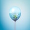 Silver fishes swimming in water minimal concept inside balloon. Flying balloon copy space idea with angelfish swimming on blue bac