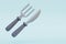 Silver fork and knife isolated on a light background. 3d render. Cutlery, silverware