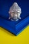 Silver Gautama Buddha Head on Colorful Blue and Yellow Background