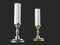 Silver and gold candle holders with white wax candles - low angle