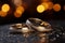 Silver and gold wedding rings sparkle on a glittery backdrop