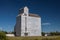 Silver Grain Elevator Against Blue Sky