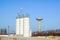 Silver Grain Silos with blue sky in background