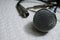 Silver Grille microphone with XLR cable on white leather SELECTIVE FOCUS