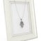 Silver Hamsa, Hand of Fatima Amulet Coulomb over Empty Photo Frame. 3d Rendering