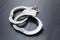 Silver handcuffs detaining crime prisoners