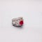 Silver handmade ring with diamonds and a red ruby