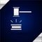 Silver Judge gavel icon isolated on dark blue background. Gavel for adjudication of sentences and bills, court, justice