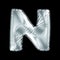 Silver letter N made of inflatable balloon isolated on black background.