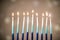 A silver menorah for the Jewish holiday Hanukkah with eight unlit candles
