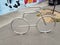 Silver metal bike rack on cement or asphalt