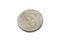 A silver Mexican coin shot against a white background