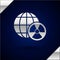 Silver Planet earth and radiation symbol icon isolated on dark blue background. Environmental concept. Vector