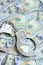 Silver police handcuffs lies on a many dollar bills