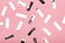 Silver rectangle confetti on pink background