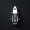 Silver Rocket ship with fire icon isolated on black background. Space travel. Long shadow style. Vector