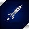 Silver Rocket ship with fire icon isolated on dark blue background. Space travel. Vector Illustration