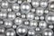 Silver Round Christmas Ornaments Background: Festive Decorative Balls for Holiday Cheer on White Background
