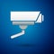 Silver Security camera icon isolated on blue background. Vector