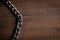 Silver shining chain on wooden background