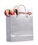 Silver shopping bag with gift on white