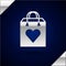 Silver Shopping bag with heart icon isolated on dark blue background. Shopping bag shop love like heart icon. Valentines