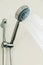 Silver shower head in bathroom with water drops flowing, Bathroom equipment